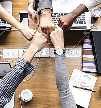 Colleagues giving a fist bump
